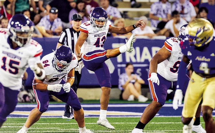 Reed Honshtein (center) had a key fake punt conversion Saturday at Nicholls. Photo by Chris Reich/NSU Photographic Services