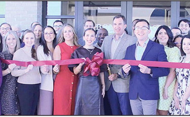 The Natchitoches Area Chamber of Commerce hosted a grand opening and ribbon cutting ceremony Thursday, March 12, for the newly opened BOM Operations Complex on Keyser Avenue. The new complex houses several key departments including Accounting, Marketing, Human Resources, Credit, Compliance, Training, Branch Administration, Business Development, Operations and Loan Administration, along with the office of President &amp; CEO Ken Hale, at center.