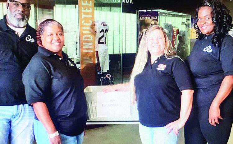 Pictured from left are NLTAC members Jumar Ficklin, Erica Jackson, Cane’s general manager Kathryn Beaudion, NLTAC member and Natchitoches Parish School Board member Tan’Keia Palmer. Not pictured is Super 1 representative Shenita Colbert.