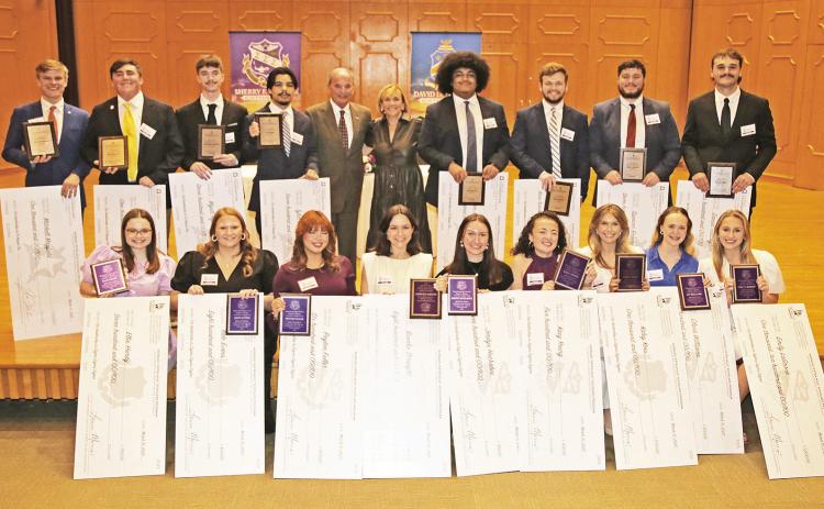 Recipients of Morgan Extra Mile Scholarship are, seated from left, Tri Sigma sisters Ellie Hardy, Kate Evans, Peyton Fuller, Brooke Straight, Jordyn Huckabee, Kacy Young, Kaley Koss, Olivia Williams and Emily LaGrone. On the back row are Pi Kappa brothers Mitchell Mayfield, Owen Stutzman, Wyatt Aguillard, Tyler Dupuis, donors David and Sherry Morgan, Sam McCray, Caid Kendrick, Spencer Bowden and Daniel Gallagher.