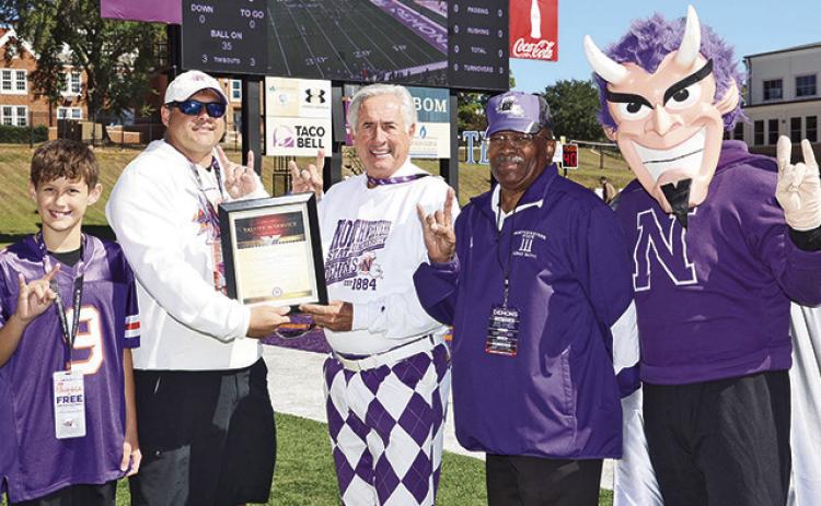 Lt. Col. (LTC) Christopher W. Kegerreis as the honorary captain during NSU’s Oct. 17 football game. From left are Baylen Kegerreis, Kegerreis, NSU President James Genovese, LTC Retired Arthur Smalley and Vic the Demon.