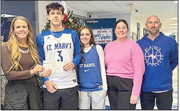BOM Bank is proud to be a Title Sponsor of St. Mary’s Catholic School’s Round Robin Basketball Tournament on Dec 29 – 30. This amazing event serves as the biggest fundraiser of the year for both the boys and girls basketball programs — and we’re always excited to support our local athletes and school spirit! Pictured from left are BOM’s Carrie Hough, Cole Yopp, Ava Hebert, BOM’s Claire Mayeaux and Head Coach Layne Huckabay.