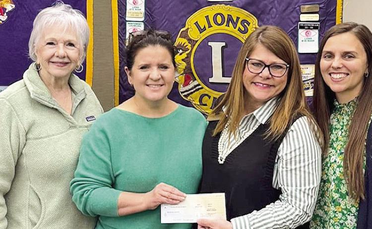 4-H Agents Pam Pearce and Amanda Clark spoke to the Natchitoches Lions club on they educational events available to 4-H members in the parish. Natchitoches 4-Hers are consistent winners in local, state and national contests. Lions club members Mimi Stoker and Jennifer Anderson, from left, are shown presenting a check to Pearce and Clark to sponsor a table at the 4-H Banquet &amp; Auction. The Banquet will be March 27 at Westside Baptist Church . Call the 4-H office at 357-2224 for more information.