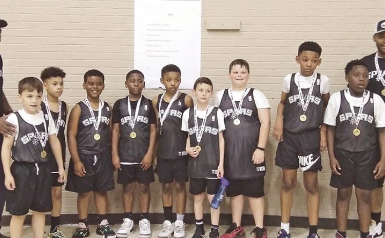 'Our Spurs coached by Derrick Solitaire and Chris Howard went into the end of year tournament as the 4th seed and came out on top as Champs!! What an exciting season it was for the 9/10 Spurs!' said City League Director Blake Dotson. Pictured from left are Coach Chris Howard, Kolbe Darbonne, Rensey Holmes, Mason Salitaire, Noah Dixon, Aiden Howard, John Ross Posey, Wilson Rhett Manuel, Ayden Nelson, Jaylen Anderson &amp; Coach Derrick Solitaire.