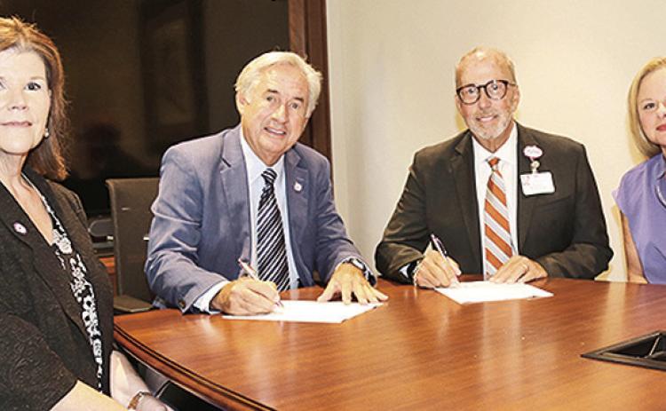 From left are NSU Executive Director for Economic Development and University Advancement Laurie Morrow and NSU President James Genovese, NRMC CEO Kirk Soileau and NSU Health Services Director Jessica Nash.