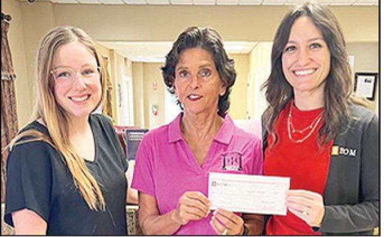 BOM Bank made a donation to Ignite 212, an organization that empowers youth and families in Natchitoches Parish through faithdriven education, mentorship, and community engagement. The donation will help provide nutritious snacks to support focus and participation during weekly sessions and incentives for children to encourage consistent attendance and active engagement. Pictured from left are BOM’s Alexis Gongre, Ignite 312 representative Anita Dubois and BOM’s Emily Breedlove.