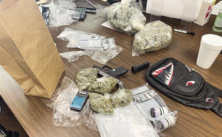 Two in custody on drugs and weapons charges