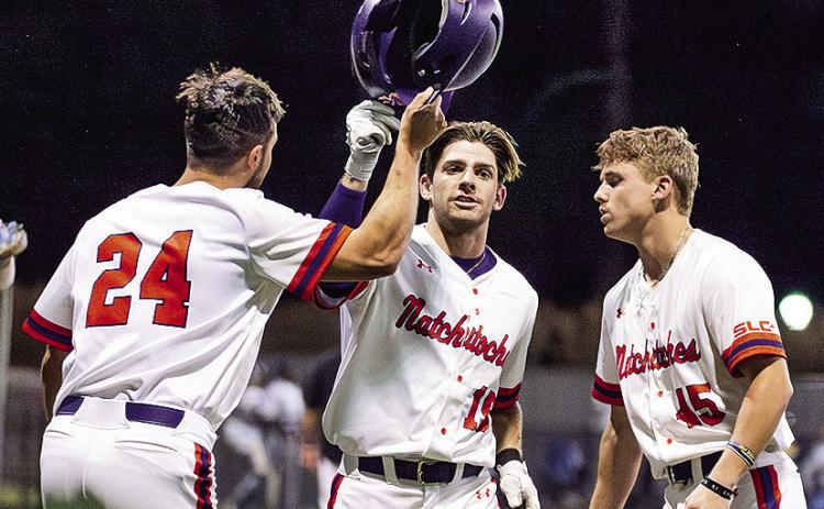 Reese Lipoma (left) and Hudson Brignac (right) congratulate Samuel Stephenson after Stephenson’s go-ahead three-run home run Tuesday night against Southern-New Orleans. Photo by Chris Reich/NSU Photographic Services