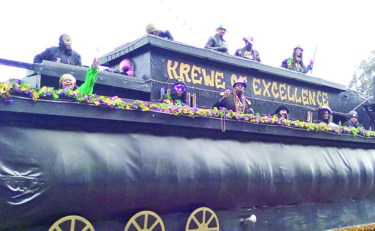 The rain stopped Saturday afternoon long enough for the inaugural Krewe of Excellence Parade to roll through the streets of Natchitoches.