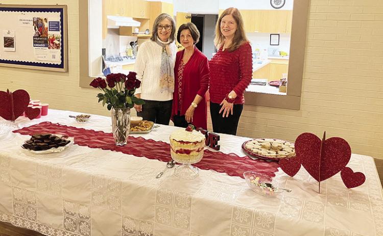 Lesche hostesses from the left are Janet Darfus, Toni Rushing and Julie Kane. They were hostesses for the February meeting.