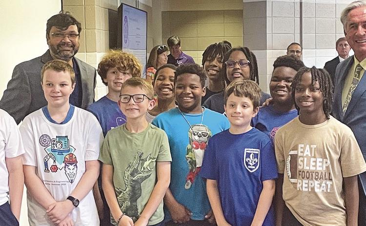 Winners of the competition were Caleb Fontenot, Carter Morgan, Darrius Armtrong Jr, Emery Wilson, Harrison Farley, Henry Moffett, Justin Keller, Kendall Hardison II and Nikeo Collins II pictured with Dr. Shahriar Hossain and NSU President James Genevese.