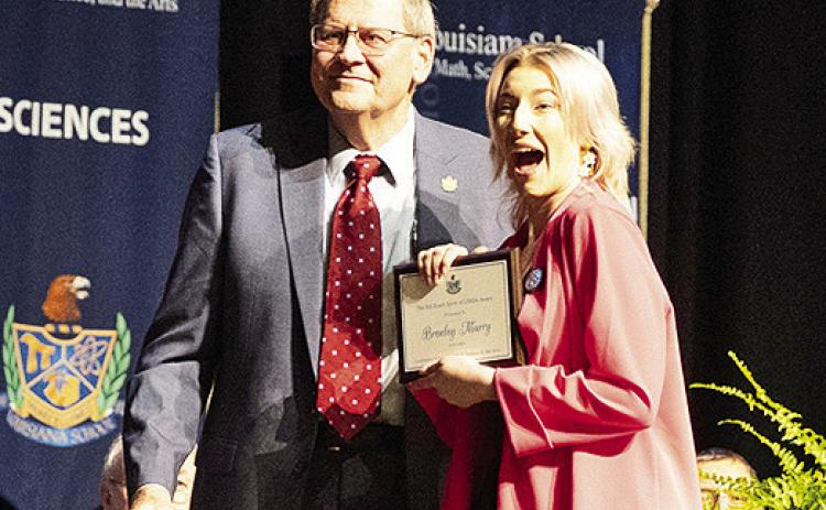 Dr. Bill Ebarb presents the Bill Ebarb Spirit of Louisiana School Award to LSMSA senior Brenley Murr.