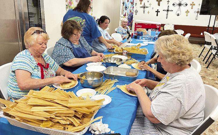 Connie Matkin, Rhonda Dupree, Tammy Wyatt, Misty Masters and Helen Presley roll the hot tamales last Thursday. Helen is beside Connie Matkin.