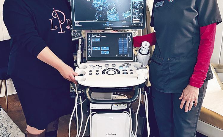 Leah Pagels, ADRMS, left, and Cathy Ingram, RN, announce the addition of a new ultrasound machine at the Women’s Resource Center.