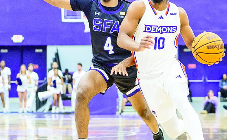 Cliff Davis (right) tied a career high with seven 3-pointers at Boise State on Tuesday night. Photo by Chris Reich/NSU Photographic Services