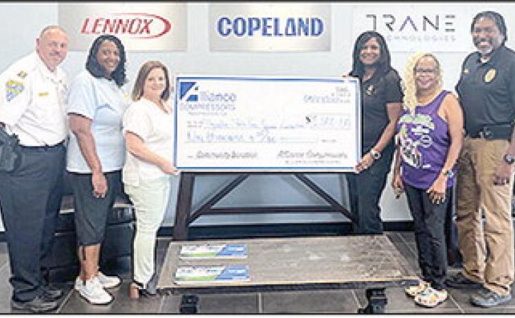 Magnolia State Peace Officers Association received a $1,000 sponsorship donation from Alliance Compressors for the Zydeco Festival. From left are NPD Capt. Billy Meziere, Sandra Williams, Lori Rivers (Alliance Compressors HR Generalist), Laquita Collins, Vanessa Monroe and Police Chief Nikeo Collins.