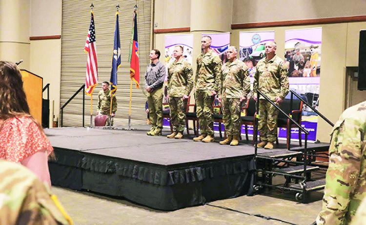 Soldiers from the Louisiana National Guard’s 256th Infantry Brigade Combat Team are honored during a deployment ceremony at the Cajundome Convention Center in Lafayette, Louisiana, April 13, 2025. Approximately 700 Soldiers are deploying in support of Operation Joint Guardian in Kosovo and Operation Enduring Freedom – Horn of Africa, where they will provide security and support operations.