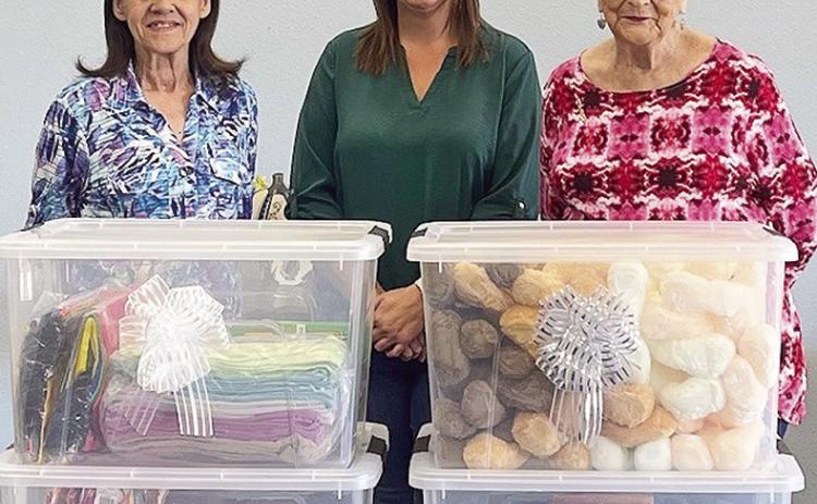 Alliance donated items for Operation Christmas Child to First Baptist Church, Provencal. Items included washcloths, towels, notebooks, pencils and a variety of toys. From left are Helen Presley; Alliance Human Resources Manager Rachel Barlow,and Barbara Gandy.