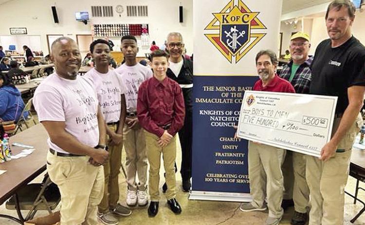 Natchitoches Junior High “Boys to Men Club” received a donation from the Natchitoches Knights of Columbus. The Knights support a large number of charities through their weekly fund raiser. From left are club director Jermaine Thomas; members, Landon Holden, Brandon Williams, and Brandon Jackson; Knights Henry Rachal, Henry Maggio and Michael Chatelain, and Grand Knight Ted Duggan.