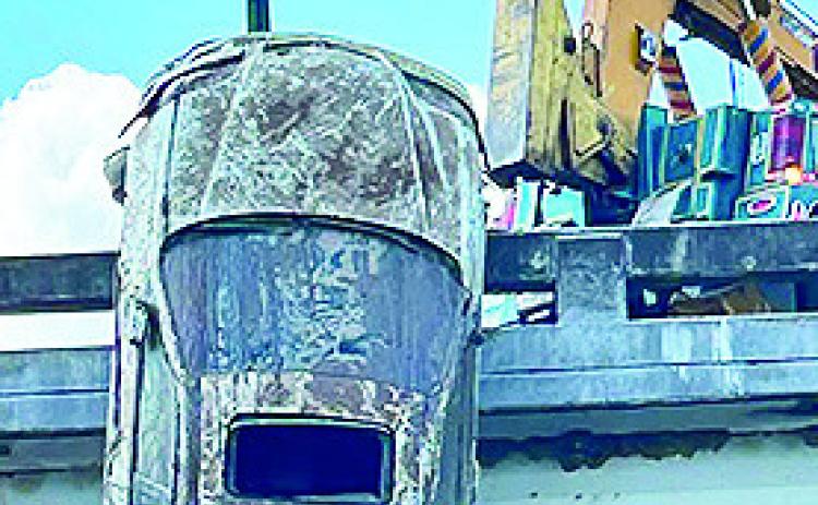 The Vehicle identification number and license plate number of this car taken from Cane River have been submitted to the National Crime Information Center to determined ownership and whether the car was stolen.