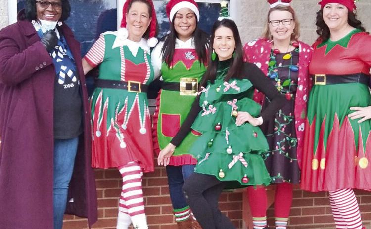 Natchitoches Magnet teachers, from left, Carletta Jones, Therisa Sesvold, Kyla Lewis, Victoria Hippler, Amelia Ferguson and Julia Hall share their Christmas spirit and excitement with students and staff Wednesday.