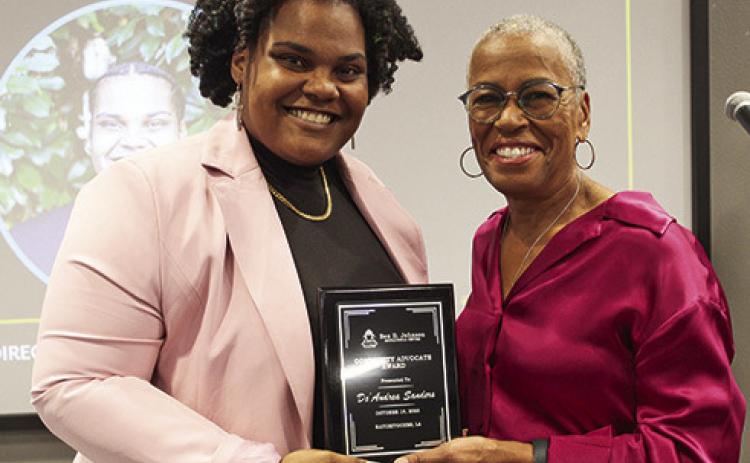De’Andrea Sanders, left, received the Community Advocate Award. Claire Prymus, president of the Ben D. Johnson Educational Center Board, presented the awards.