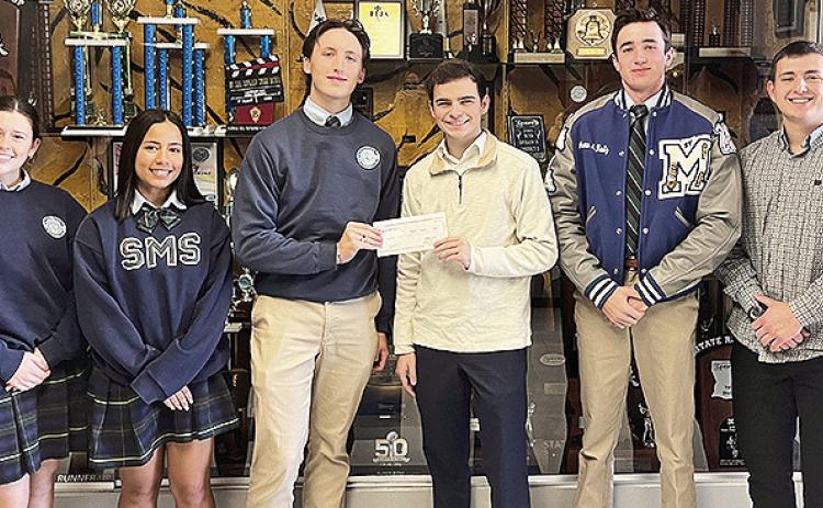 BOM is a sponsor of the St. Mary’s Catholic School tennis team. Pictured from left are Baylea Johnson, Maddie McQuiddy, Colton Cross, BOM’s Zach Cooper, Andrew Kautz, and BOM’s Nick Knotts.