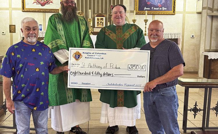 Knights present check to St. Anthony Catholic Church. John Abraham, Deacon Steven Newbury, Father John O’Brien, and Mike Scott.