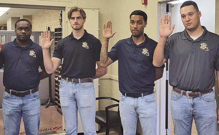 From left are new deputies Braden Arnold, Kaleb Edwards, Kyron Dunn and Jacob Bellow.
