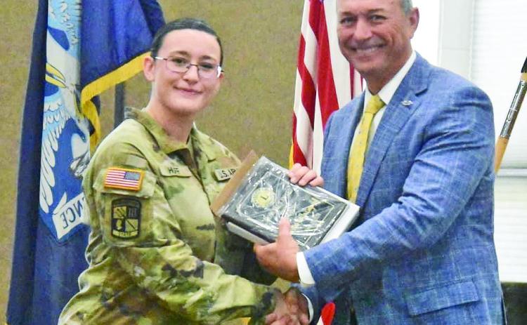 Natchitoches Lion Mark Kerry presented the Lions Club ROTC award to Camryn Huff at the NSU ROTC Spring Awards.