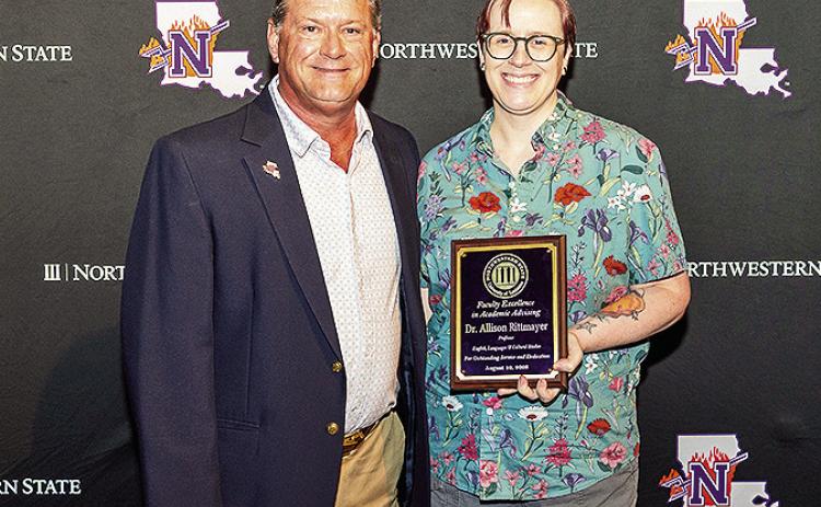 Dr. Allison Rittmayer, right, was honored for Excellence in Academic Advising. The award was presented by Steve Hicks, executive director of Academic Engagement and Student Success.