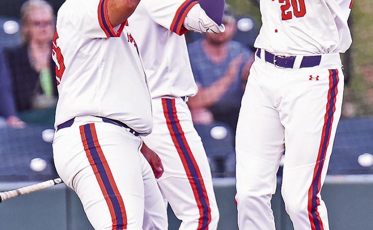 Bryce Johnson (20) celebrates a home run in Tuesday’s 11-1 victory over Grambling at Brown-Stroud Field. Photo by Gary Hardamon