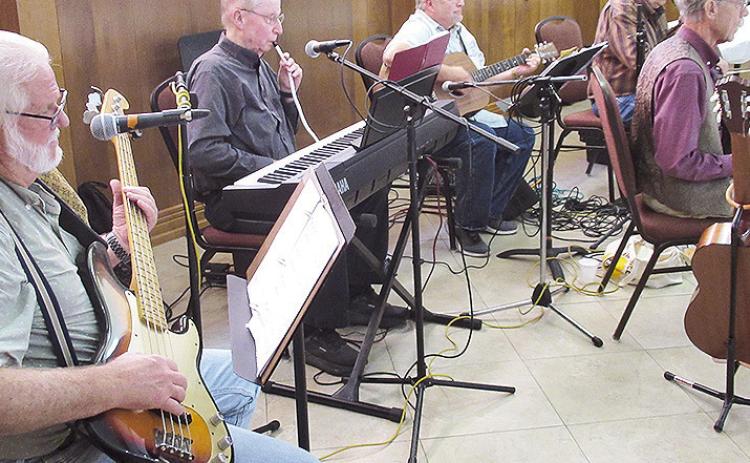 The Back Porch Band provided entertainment with a musical program of Gospel and traditional songs, including “Be Thou My Vision”, “City of New Orleans” and “Georgia on My Mind.”