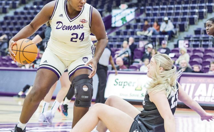 Jordan Todd (left) powers through the defense of Tarleton in a 59-51 win. Photo by Chris Reich, NSU Photographic Services