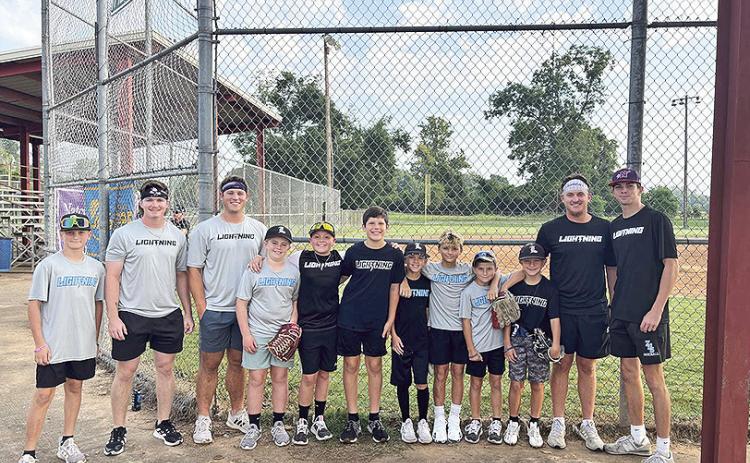 LA Lightning 11U and Northwestern State University baseball team joined forces last weekend for the Natchitoches Area Jaycees Wiffleball Tournament at the Old Dixie Youth Complex. All proceeds from the tournament benefitted the NRMC Cancer Center Serenity Garden and Bell Tower. Pictured from left are Ryne Williams, Ethan Bourg, Brandon Carter, Jax Errington, Liam Mahloch, Murphy Linebaugh, Carter Hough, Cohen Gandy, Archer Johnson, Callen Bertrand, Clay Jung, and Dylan Marionneaux.