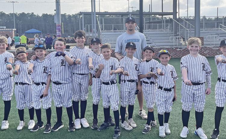LA Lightning coached by BOMFS’ Donovan Ohnoutka won 2nd Place in the USSSA Battle of the Belts 10U Tournament at Parc Natchitoches last weekend. Pictured from left are Ryne Williams, Callen Bertrand, Luke Fair, Liam Mahloch, Murphy Linebaugh, Gavin Key, Carson Gentry, Coach Donovan Ohnoutka, Cohen Gentry, Carter Hough, Archer Johnson, Jax Errington, and Adam Todtenbier.