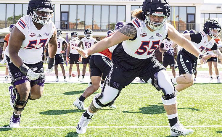 Isaiah Ybarra (55) and his teammates go through a workout earlier in spring practice. Photo by Chris Reich/NSU Photographic Services