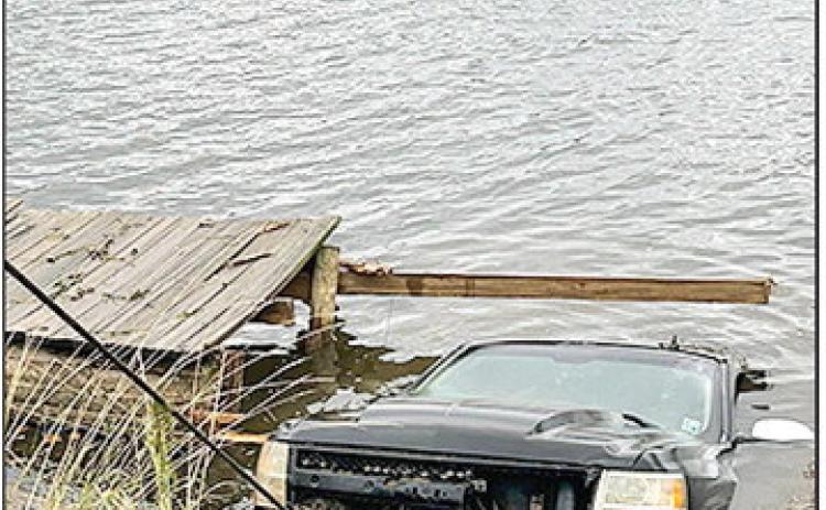 NPSO divers, top of photo, assisted with removing a submerged from Cane River. The driver escaped and swam to shore.