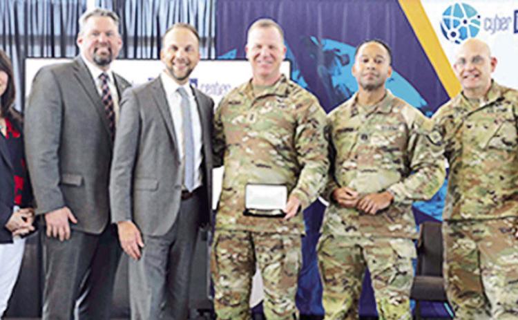 From left are Louisiana State Rep. Dodie Horton, District 9; Louisiana State Sen. Adam Bass; Kevin Nolten, president of the Cyber Innovation Center; Maj. Gen. Thomas Friloux, adjutant general of Louisiana, holding a commemorative key to the Cyber Innovation Center; Capt. Charles Armstrong, commander of the 178th Cyber Protection Team; and Col. Joseph Barnett, commander of the 61st Troop Command.