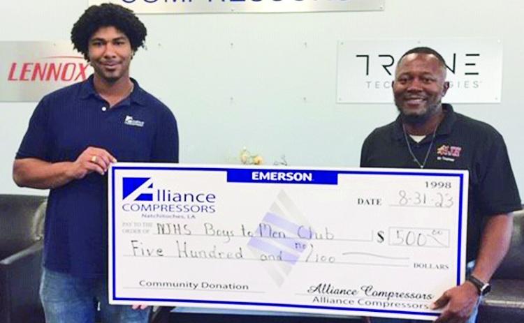 Alliance Compressors donated $500 to the NJHS Boys to Men Club. The Club, founded in 2018, involves community service, brotherhood, and exemplary training to 7th and 8th graders. Money earned and donated is used to buy dress clothes for the students as well as items for nursing home residents. The Club has adopted Natchitoches Nursing & Rehabilitation Center as well as Kindergarten students at Weaver . From left are Joseph Bayonne, Alliance Training Specialist; and Jermaine Thomas, Boys to Men Club Founder/