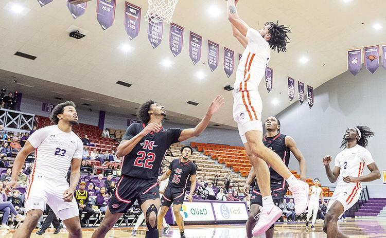 Addison Patterson lays in a basket during Northwestern State’s 68-66 win against Nicholls on Saturday. Photo byChris Reich/NSU Photographic Services