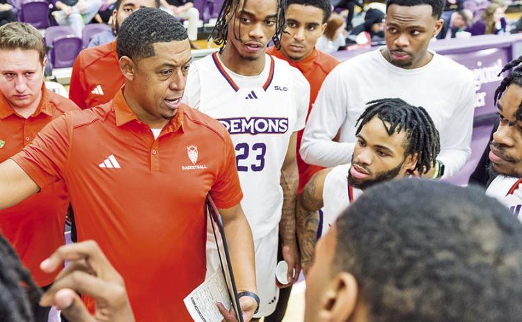 NSU head coach Rick Cabrera’s (center) late father, Hugo, was a twotime All-American at then-East Texas State, now Texas A&amp;M-Commerce. Photo by Chris Reich/NSU Photographic Services