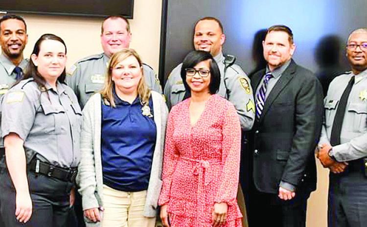On front row from left are Sgt. Stacy Cruz, Communications Supervisor Kim Green and Deputy Felecia White. In the back row are: Sgt. Garret Murchinson, Major Chad Nelson, Sgt. Eric Mogridge, Sgt. David Dorsey, Lt. Jonathan Byles, Sgt. Earnest Sowell and Sheriff Stuart Wright. Not pictured is Lt. J. Roberts.