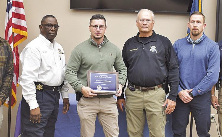 From left are Human Resources Director Joe Hamilton, Chief Deputy Darrel Winder, Deputy of the Month for November Det. Sgt. Garrett Murchison, Sheriff Stuart Wright, Lt. J. Roberts and Det. Cpt. G. Sers.