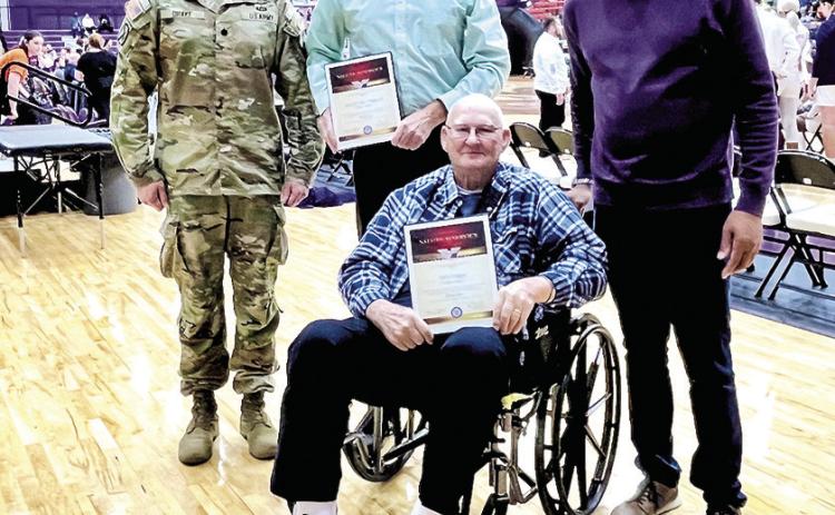 NSU Athletics recognized Ted Duggan, his son Ted Duggan II during the Demons’ Feb. 3 basketball game. From left are LTC Josh Drake, Ted Duggan II, Duggan and NSU President Dr. Marcus Jones.