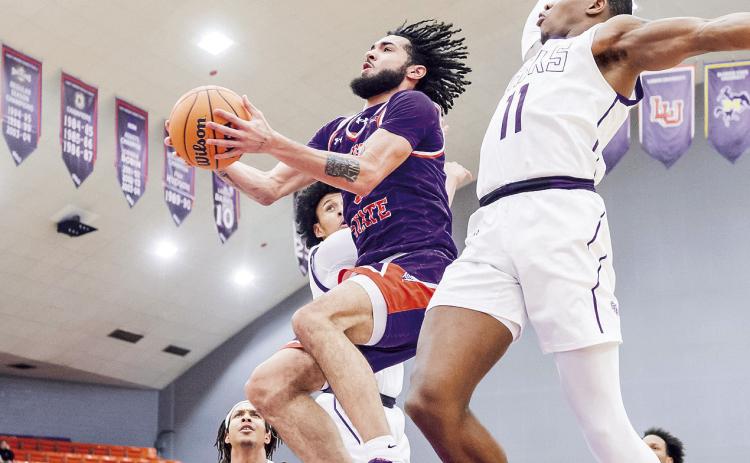 Addison Patterson (center) led Northwestern State with 23 points and 10 rebounds in Saturday’s loss to Stephen F. Austin. Photo by Chris Reich/NSU Photographic Services