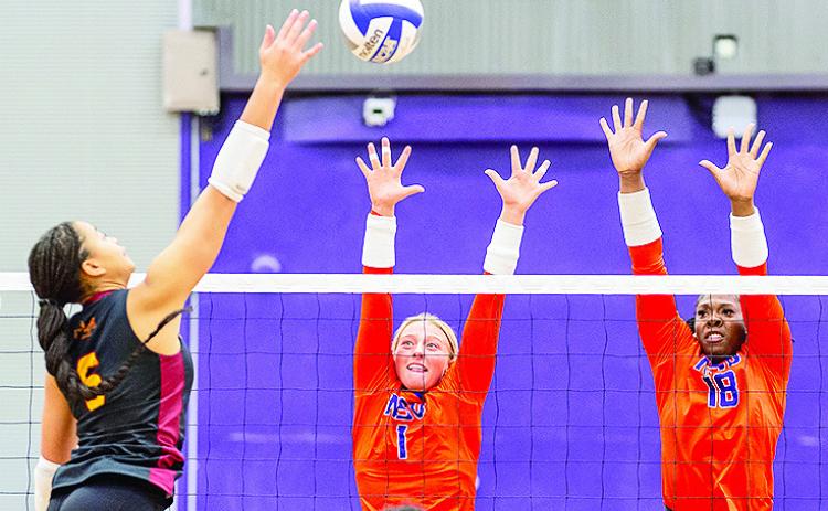 NSU’s Julia Whitfield (1) and Deja Benjamin go for the block. Photo by Chris Reich, NSU Photographic services