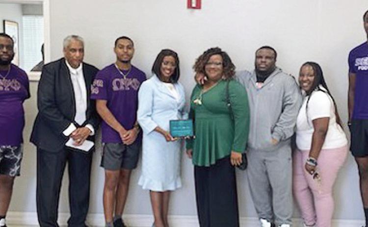 From left are Jalen Sturgis, the Rev. The Rev. Gerald Danzell, Carlton Johnson, Jr., Diane Blake Jones, Debra Dumars, Daniel Dumars, Brianca Wilkinson and Tra’von Jones.