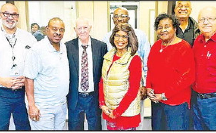 Pictured from left are Outpatient Medical Center CEO Dr. Mark Guidry, treasurer Ronnie Evans, vice president Arthur Ward, board members Diane Jones, Melvin Holmes, Berteal Rogers, secretary John E. Winston and president Thomas Roque.