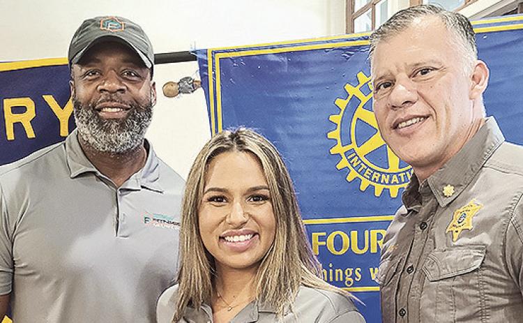 Rotarian with the Program Jesse Taitano introduced the owner of PREP Fitness and Performance Brian Hicks and PREP Lead Service Representative Kristen Harris at the December 17 luncheon. Hicks shared the Mission Statement to help as many people as possible plan, prep, and live the life they chose without any limitations. Also, he gave an overview of the updated facilities and services. Pictured from left are Hicks, Harris, and Taitano.